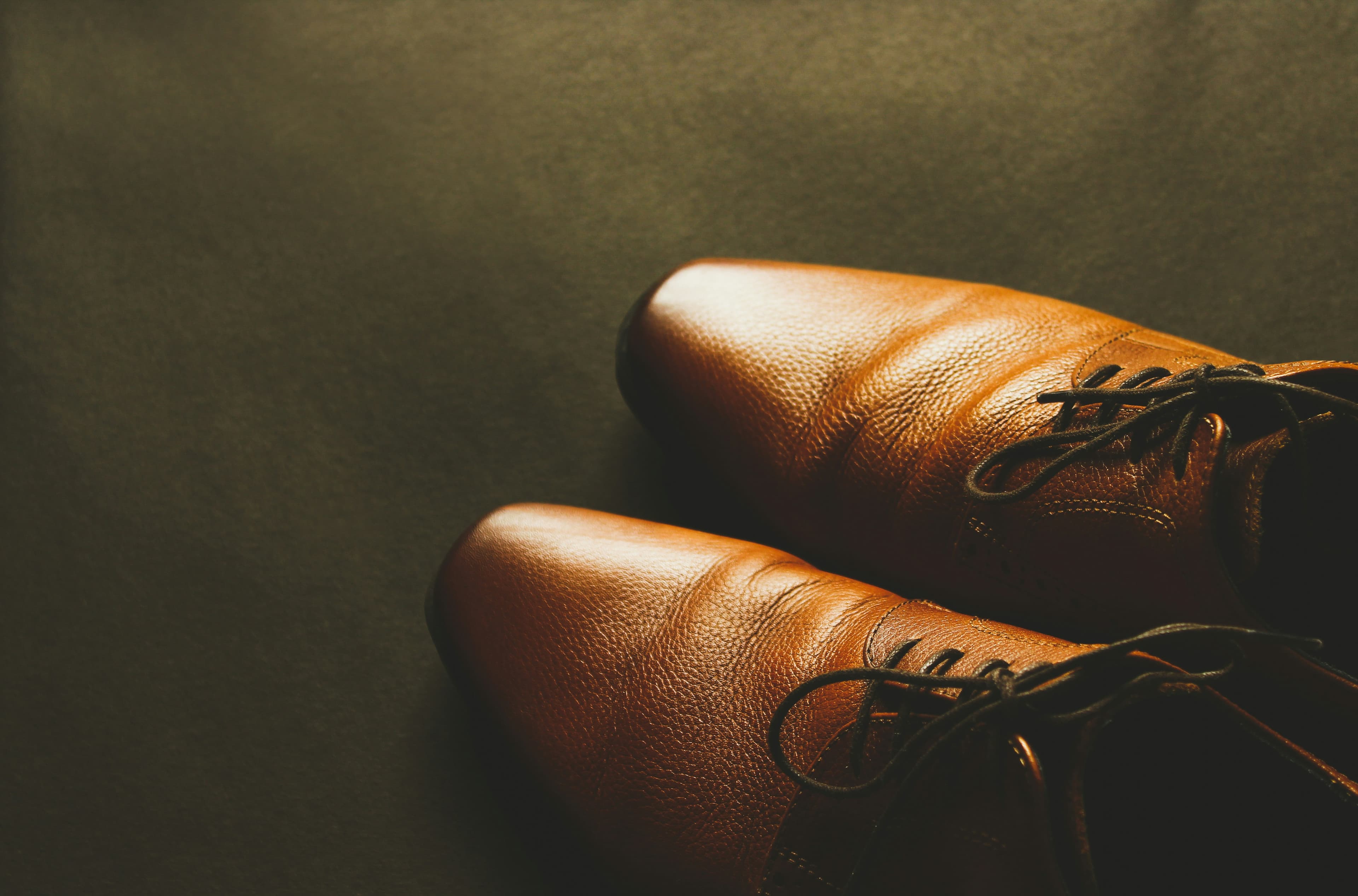 Premium brown leather dress shoes representing our custom fitting expertise