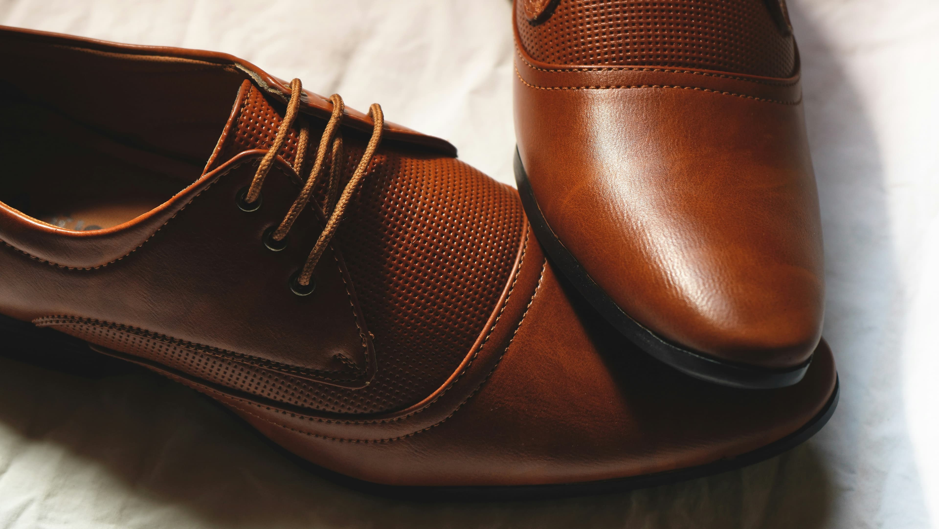 Brown leather formal dress shoes showcasing our premium men's collection